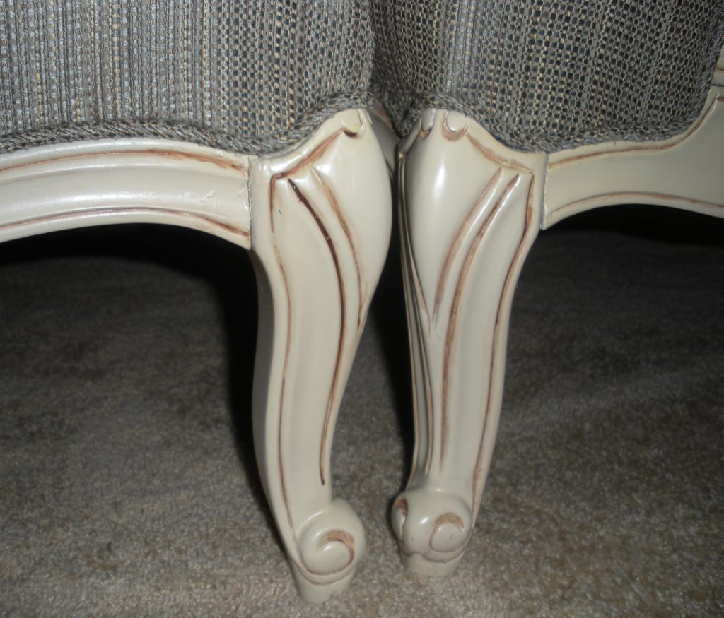 close up image of wood color on chair and ottoman